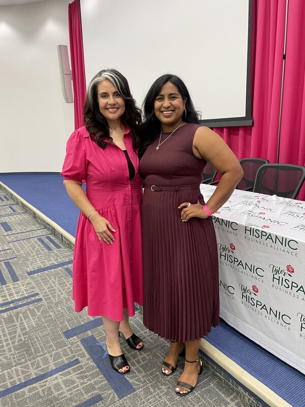 two Hispanic women standing next to each other