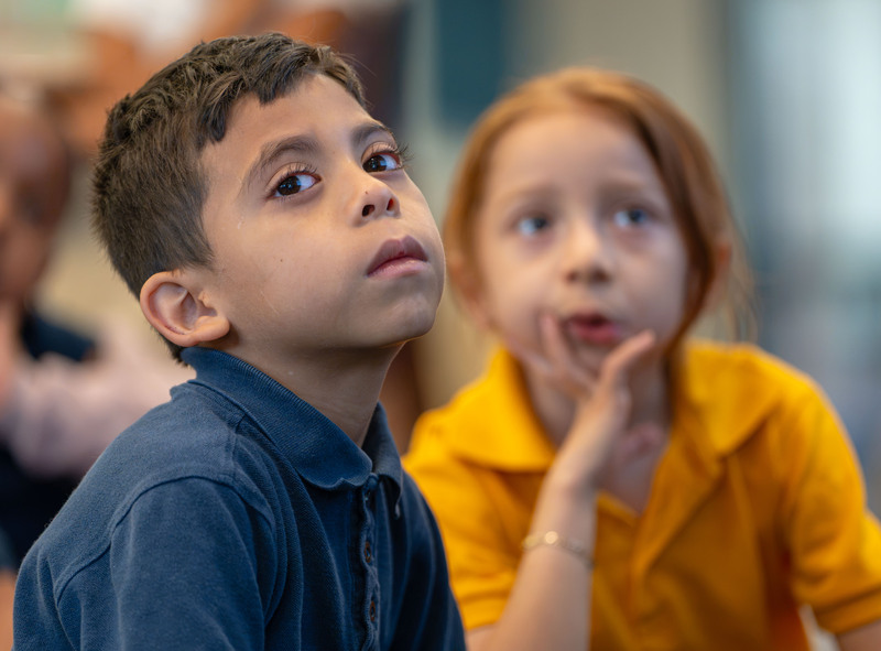 young boy and girl listening to story