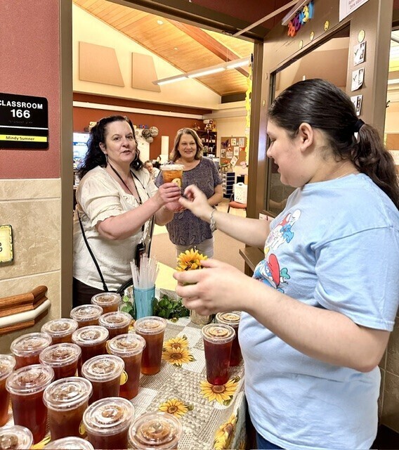 Buzzing Brews serving tea