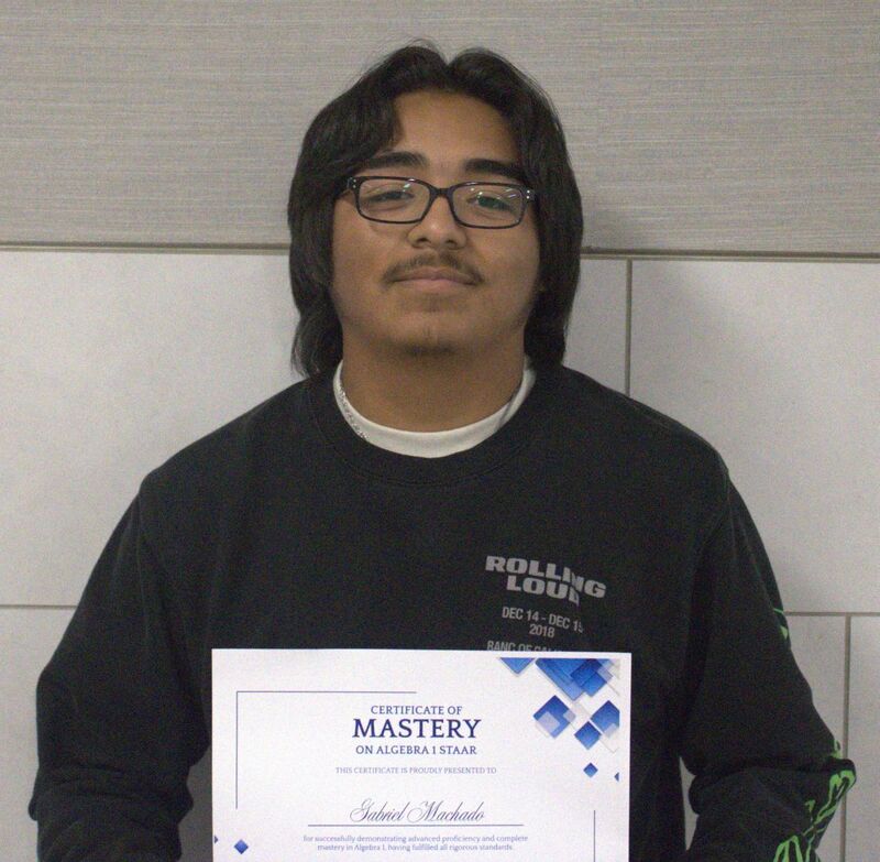 student holding a certificate