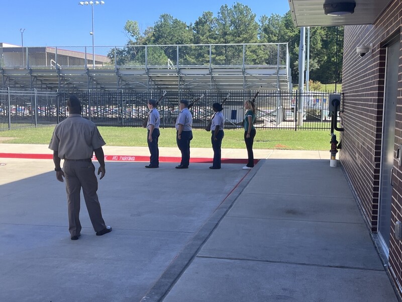 JROTC students marching in formation