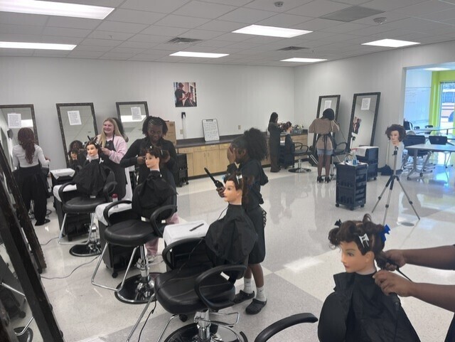 Students practicing barrell curls