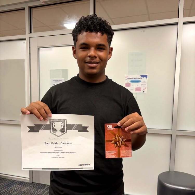 student holding a certificate