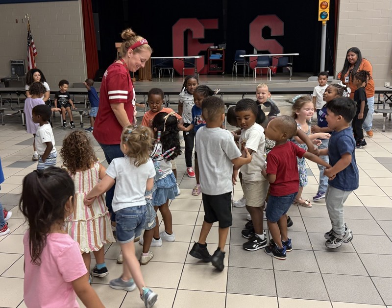 students dancing with principal at dance party