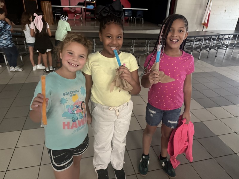 students wating popsicles at dance party