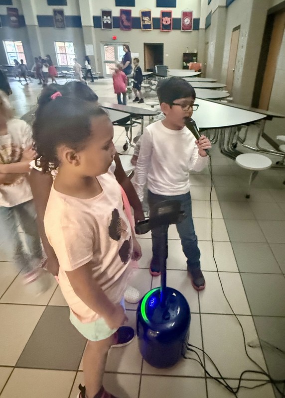 students singing karaoke