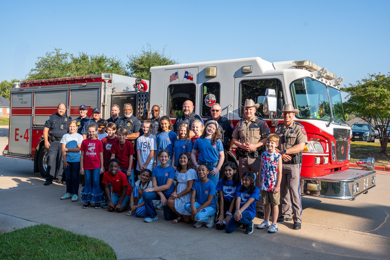elementary students in front of a fire truck