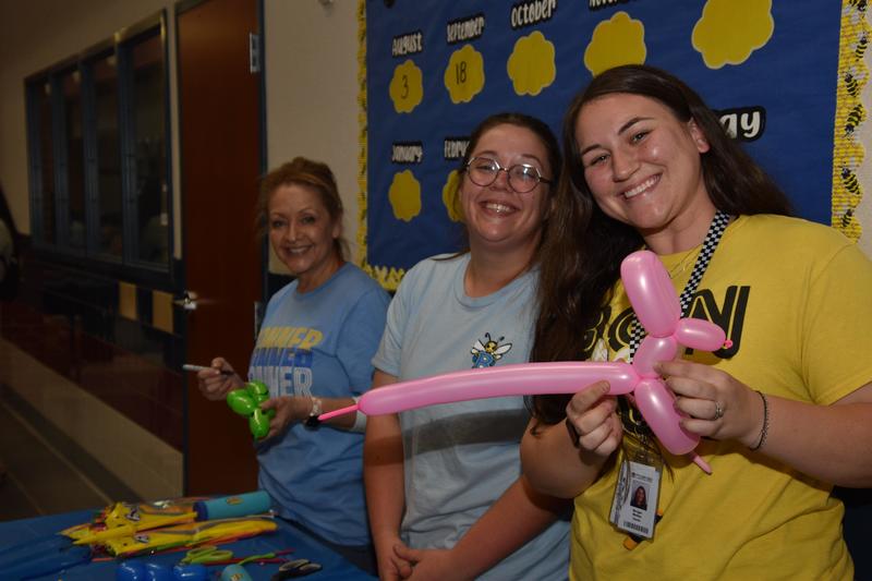 women making balloon animals