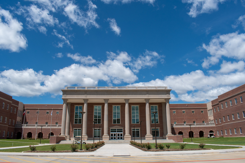 brick school building with large pillars