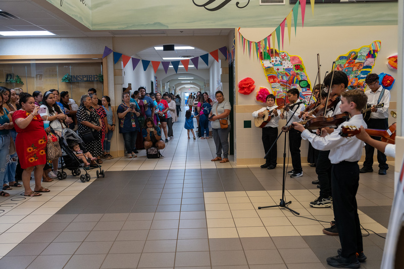 elementary kids playing mariachi instruments