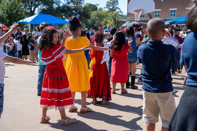 elementary kids dancing in line outside school