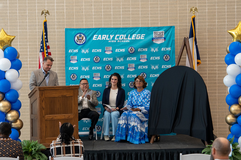 man and women sitting on stage