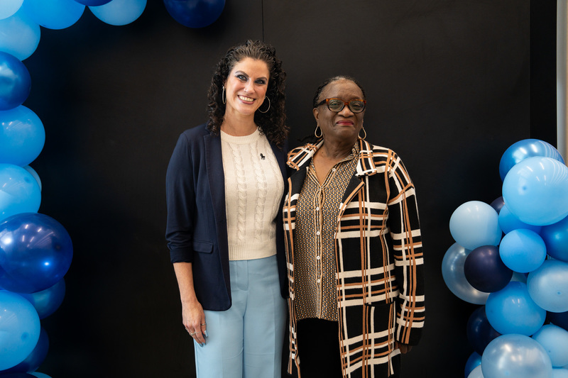two women standing beside each other