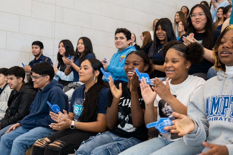 high school kids clapping in crowd