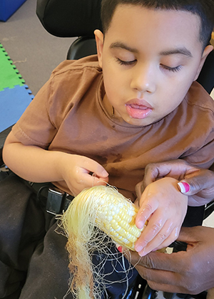 students exploring farm produce