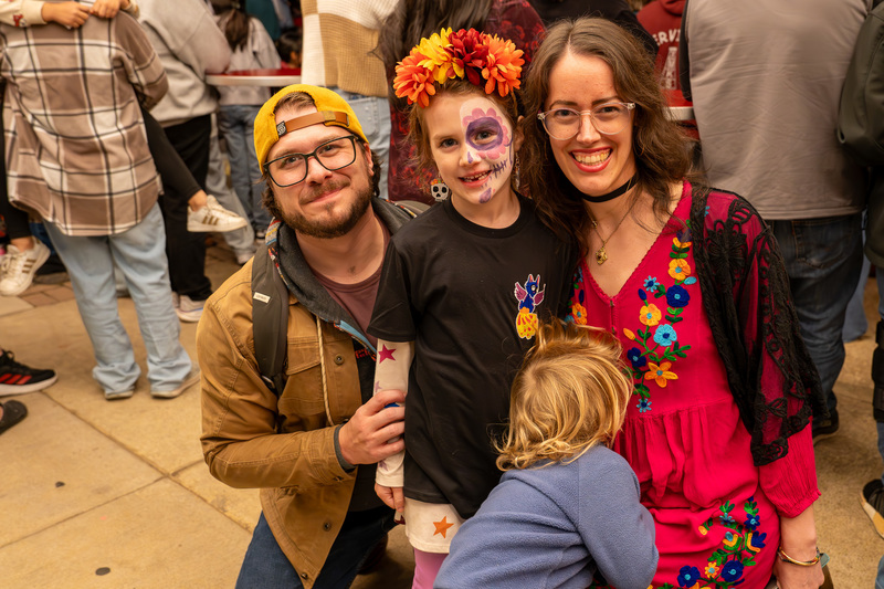 man, woman, and young child