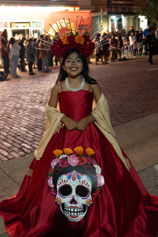 elementary age girl in long red dress