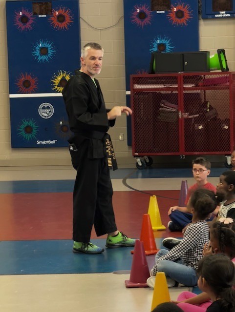 students learning martials arts in PE class