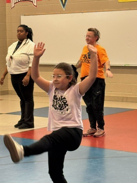 students learning martials arts in PE class