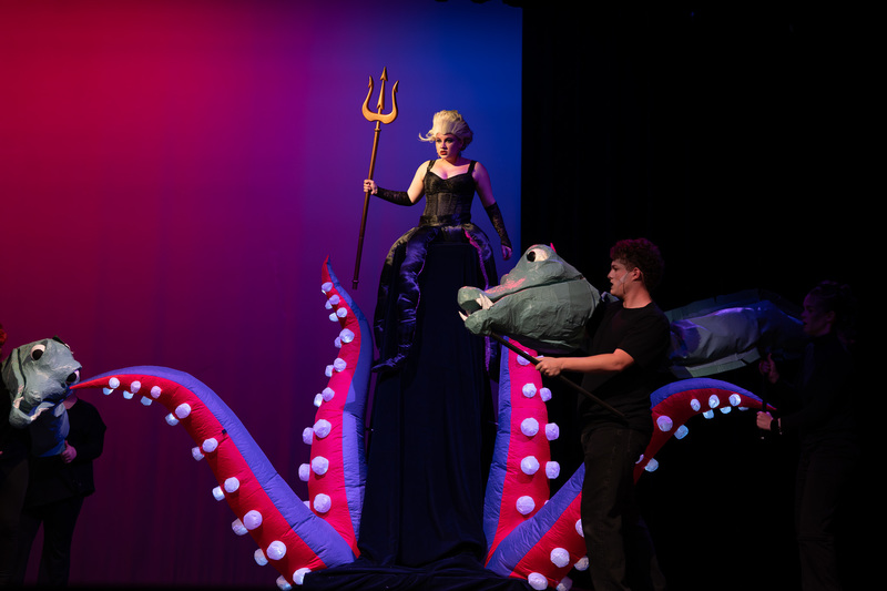 teen on stage dressed as Ursela from Little Mermaid