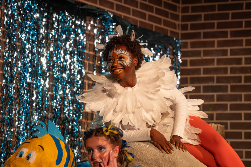 teen dressed as bird on stage for perfomance