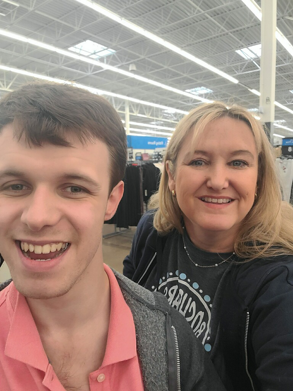 teen boy and woman smiling