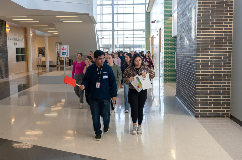 teens walking down a school hallway