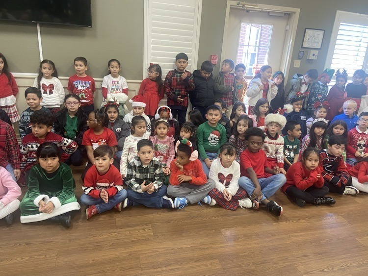 elementary age kids in Christmas outfits