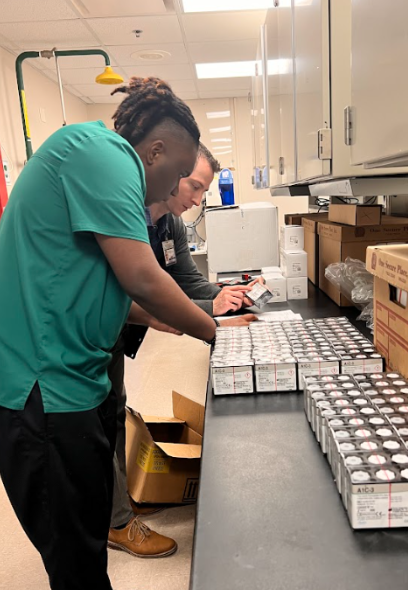 teen boy stacking supplies on counter