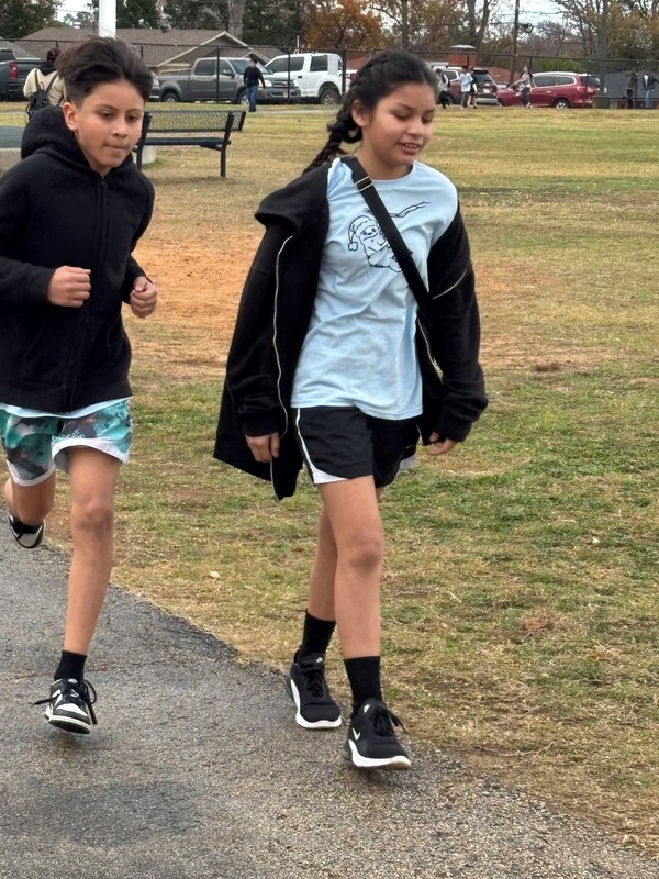 kids running around a track