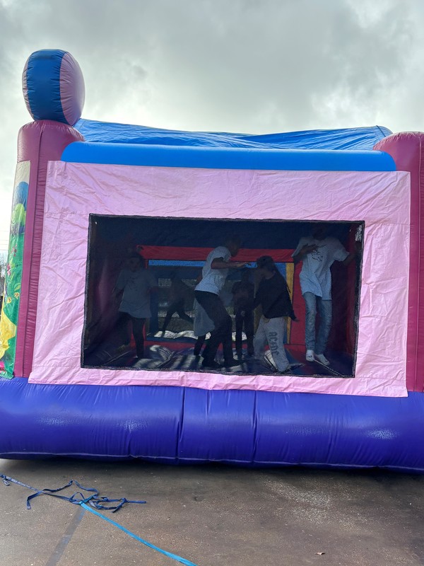 kids jumping in a bounce house