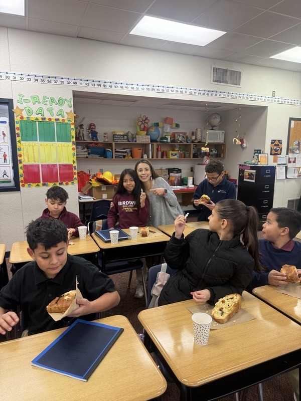 students in classroom enjoying bread
