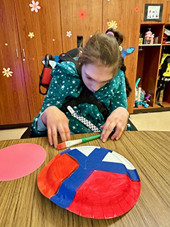 Special Needs Student creating a "Peace Plate" for MLK day
