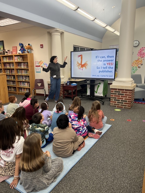 Anna Raff explaining the illustration process to a group of students
