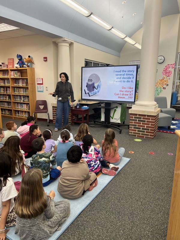 Anna Raff explaining the illustration process to a group of students