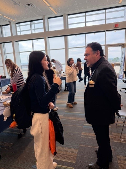 man talking to teens