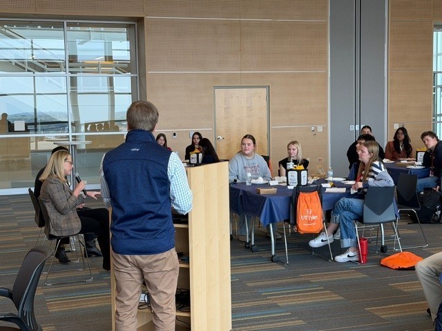 man talking to group of people