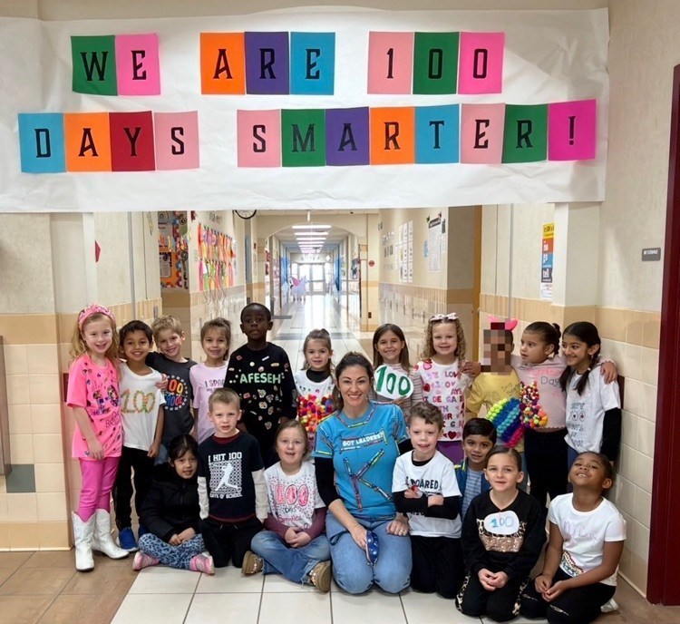 students celebrating the 100th day of school by dressing up with 100 things