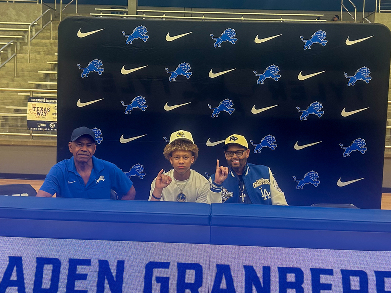 Tyler High student-athlete smiles and signs to play at the collegiate level