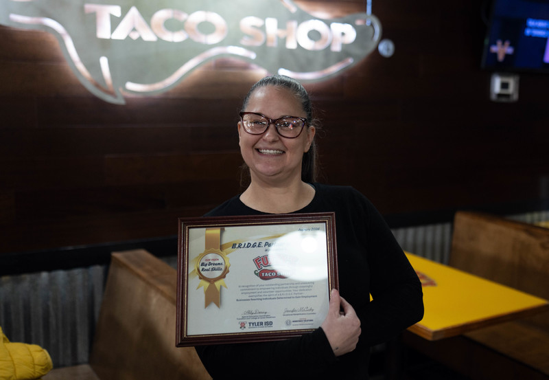 woman holding certificate