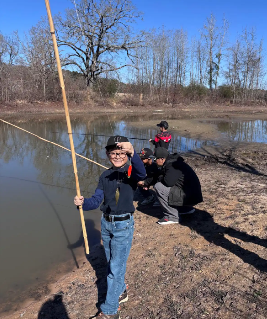 kid with fishing pole