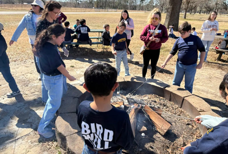 kids around camp fire