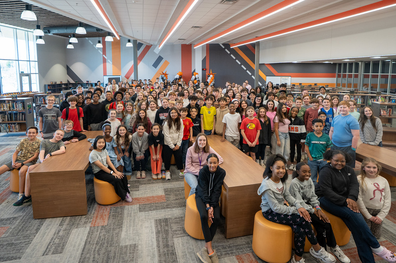 middle school kids crowded into library