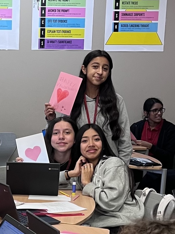 teens holding homemade Valentine's cards