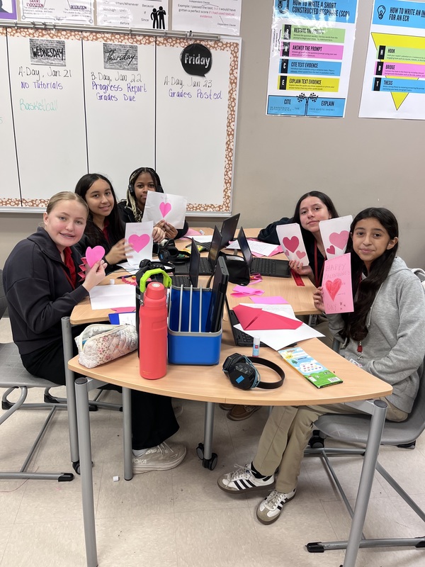 teens holding homemade Valentine's cards