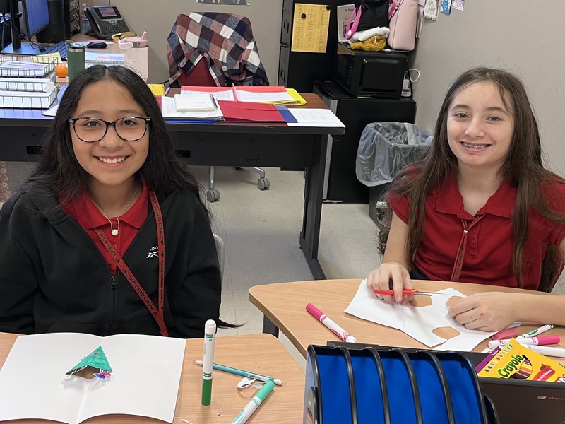 teens holding homemade Valentine's cards