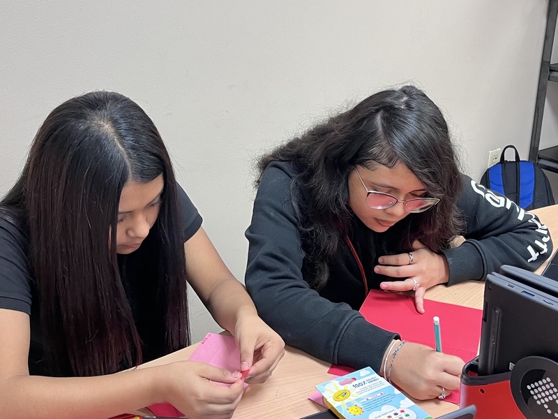 teens holding homemade Valentine's cards