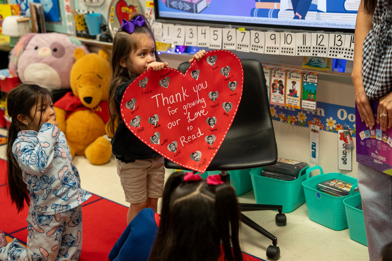 Pre-K girl holding giant Valentine card