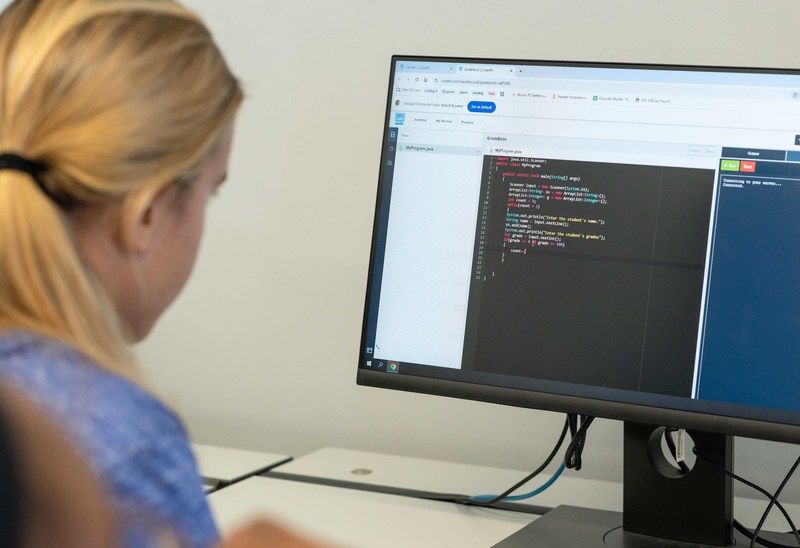 teen girl looking at computer
