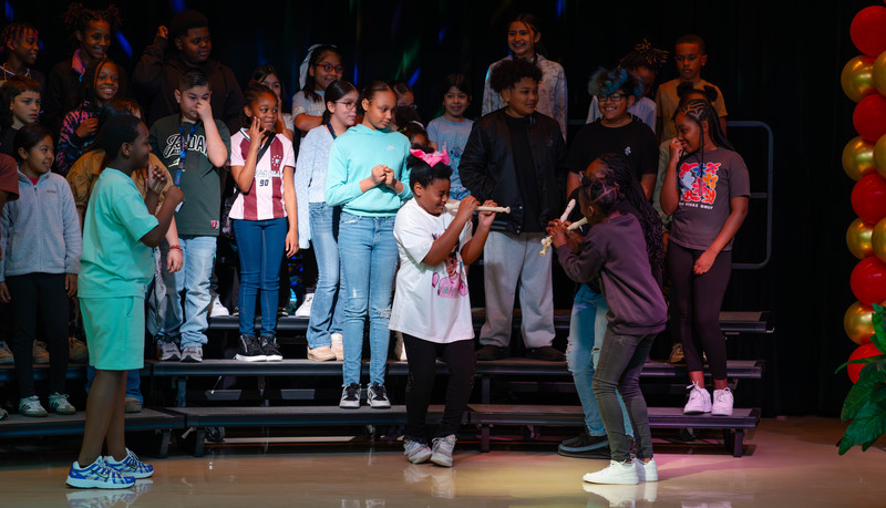 kids on stage singing